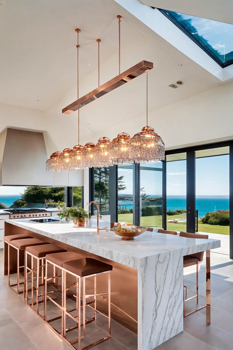 Luxury kitchen remodel in Los Angeles featuring a contrasting dark wood island, white cabinetry, marble countertops, and a custom stainless steel range hood.